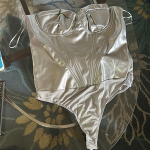BRAND NEW, never worn tag still on FashionNova silver thong body suit with cups